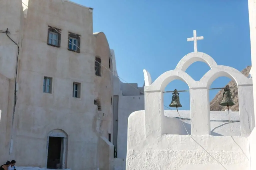 A detail shot of bells in a whitewashed bell tower in Emporio, Santorini.