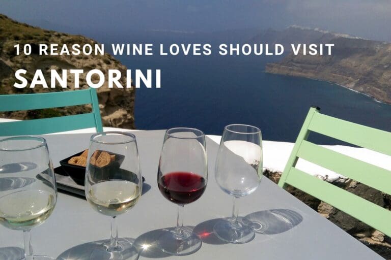 Three glasses of Santorini wine with a stunning view of the Caldera in Santorini