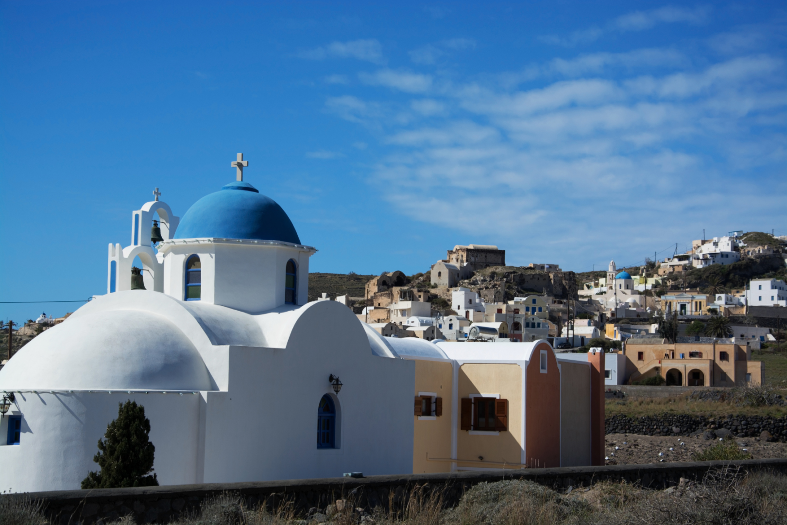 Akrotiri Village Santorini | Traditional Cycladic Village on the Island Highlights Tour Akrotiri village Santorini blue domed church and traditional Cycladic architecture