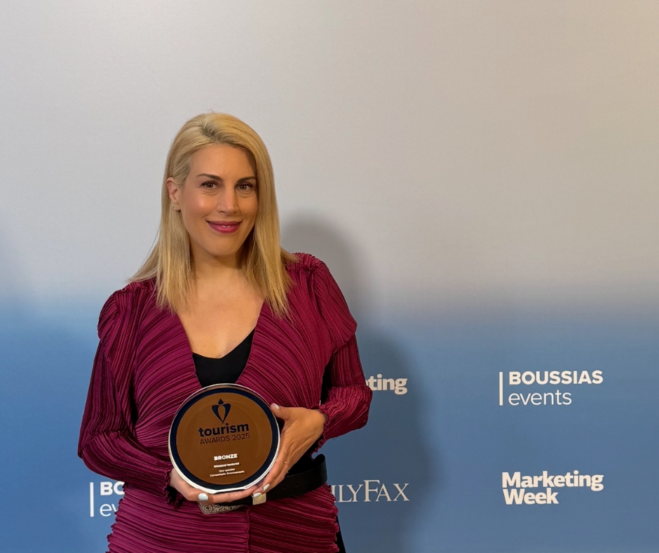 Co-founder of Wineland Tours holding the Bronze Award at the Greek Tourism Awards 2025.