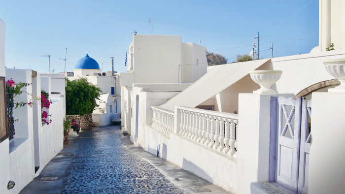 Traditional cobblestone street in Megalochori village, Santorini.