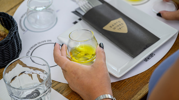 Santorini olive oil tasting using a professional glass during a guided sensory experience